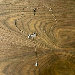 SWAROVSKI 
Lifelong Bow Y necklace，Bow, White, Mixed metal finish